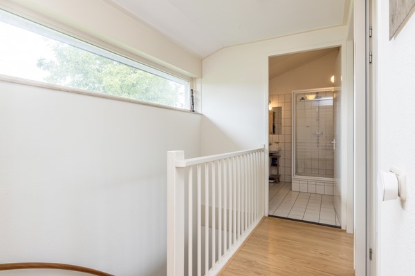 Foto - Te koop: Tussenwoning uit 2007 voorzien van een energielabel A met onder meer een ruime woon- en eetkamer, semi-open keuken, 3 slaapkamers, badkamer, carport en besloten (voor)tuin in Ransdaal